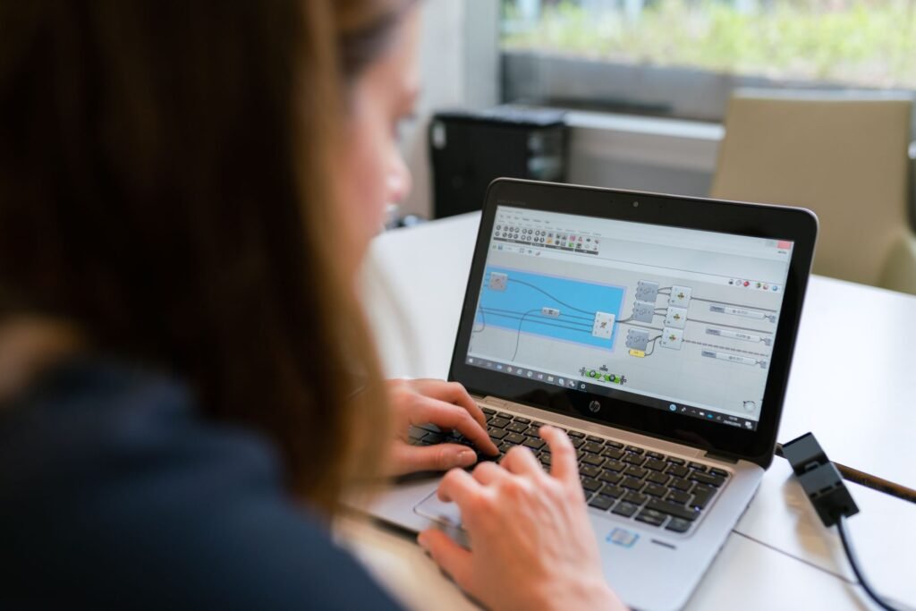 Engineer working on workflow automation software on a laptop